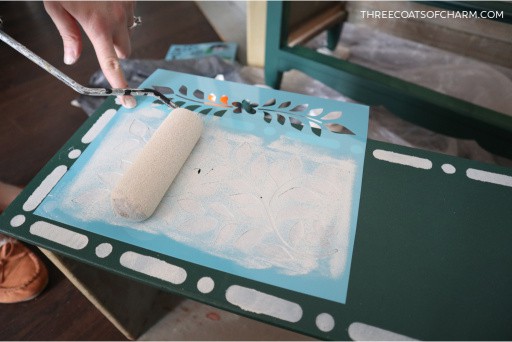 Painting a stencil with a roller